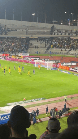 Rainy night soccer match draws cheering crowds in Mexico City
