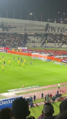 Rainy night soccer match draws cheering crowds in Mexico City