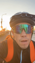 Cyclist rides through sunrise in Chaikovsky, Russia