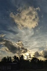 Sunset skies and contrails over Karang Indah, Indonesia