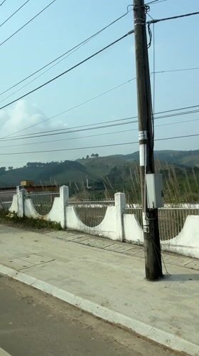 Morning drive through landscaped Bo Y reveals ornate fencing
