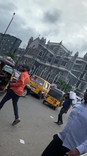 Morning street activity recorded near gothic church in Lagos