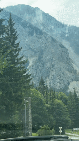 Driving past a rugged scree slope in Tržič, Slovenia