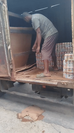 Street life and a beverage delivery in Yenagoa, Nigeria