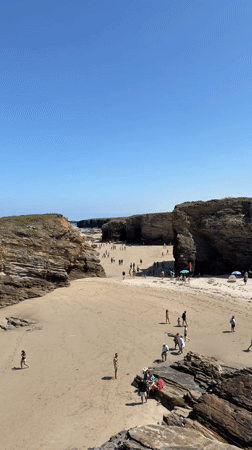 Ribadeo's rugged cliffs, sea caves, and calm summer coastline