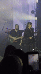 Female singer performs with band in Linz, Austria