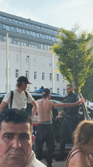 Vienna plaza buzzes with fountain play, football screens, and street life