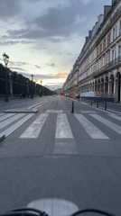 Evening bicycle ride captured on classical Paris street