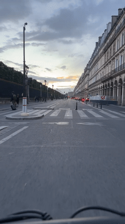 Evening bicycle ride captured on classical Paris street