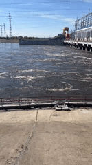 Dam releases water in Noviy, Russia amid clear conditions