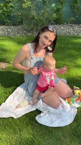 Mother and baby enjoy picnic in Krasnodar park