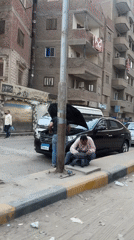 Daytime street activity observed in Giza residential area