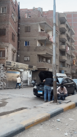 Daytime street activity observed in Giza residential area