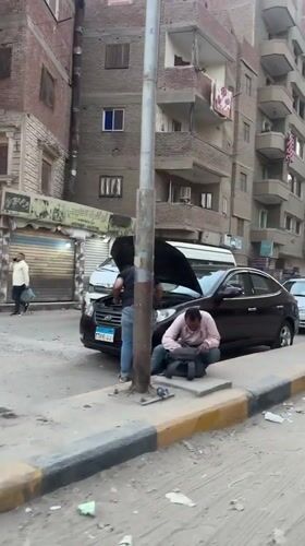 Daytime street activity observed in Giza residential area
