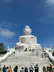 Tourists document Big Buddha landmark in Karon, Thailand