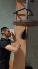 Man practices speed bag training indoors in Sofia