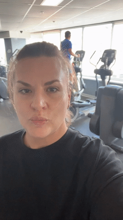 Woman smiles at camera in Novosibirsk gym