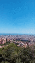 Clear skies frame aerial views of Barcelona cityscape