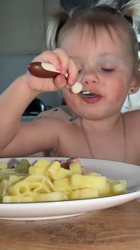 Child enjoys meal with face paint in Reshetnikovo