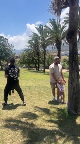Family playtime captured in sunny Haifa park