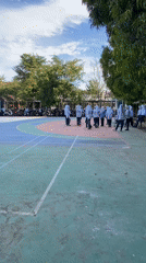 Synchronized group exercise on a colorful outdoor court
