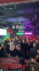 Moscow nightclub busy with patrons socializing on Saturday evening
