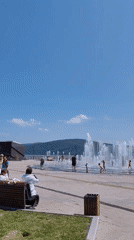 Fountain plaza hangout with a novelty cap in Komsomolsk-on-Amur