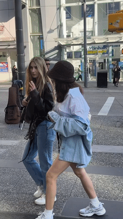 Street musician performs electric guitar near Vancouver's Pacific Centre