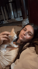 Woman photographed with kitten in intimate portrait session, Mũi Né