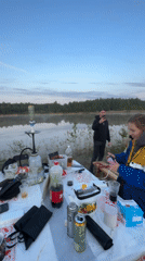 Lakeside camping party documented in Novyi, Russia