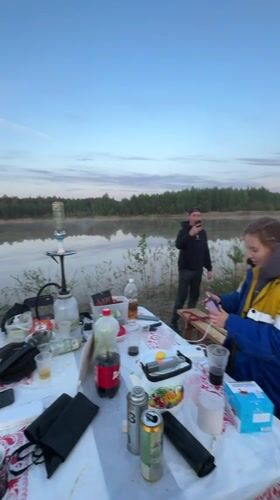 Lakeside camping party documented in Novyi, Russia