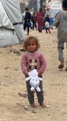 Child with toy observed in Gaza refugee camp