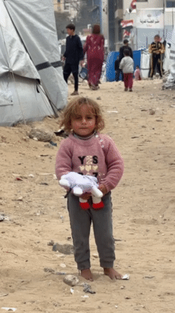 Child with toy observed in Gaza refugee camp