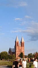 Sunny afternoon stroll by the river and church in Svietlahorsk