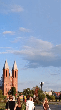 Sunny afternoon stroll by the river and church in Svietlahorsk