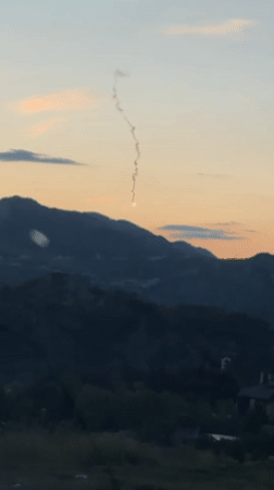 Flare burns against mountain backdrop near Cetinje, Montenegro