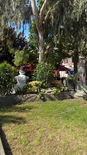 Park scene with decorative snowman statue captured in Sirius, Russia
