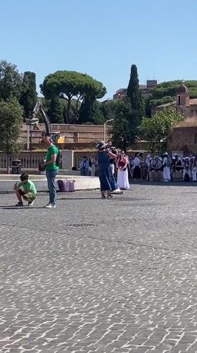 Violinist performs near St. Peter's Basilica on a clear Rome morning