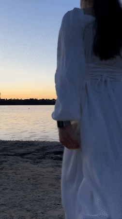 Dusk at a Ternopil lakeshore, crescent moon rising