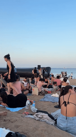 Open-air beach cinema draws a crowd in Barcelona