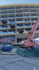 Construction activity and glass dome facility documented in mountainous area