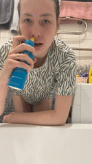 Woman does laundry in Moscow bathroom