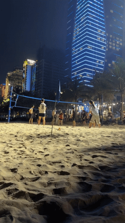 Beach volleyball and restaurant dining captured in Da Nang
