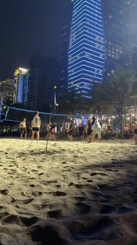 Beach volleyball and restaurant dining captured in Da Nang