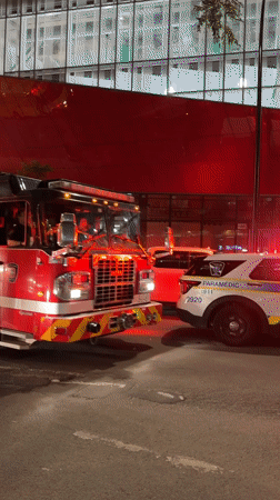 Multiple emergency vehicles respond to a nighttime Montreal incident