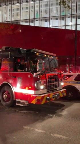 Multiple emergency vehicles respond to a nighttime Montreal incident