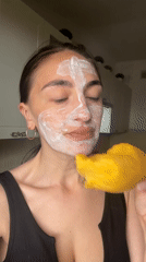 Woman documents facial mask self-care routine with dog in Sochi