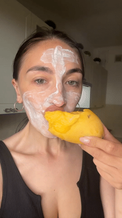 Woman documents facial mask self-care routine with dog in Sochi