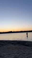 Running toward the water at golden hour on a Ukrainian beach