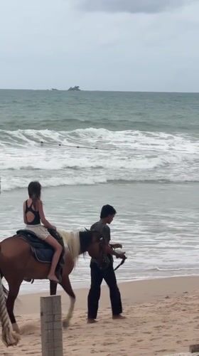 Overcast morning on a Choeng Thale beach with horseback riding